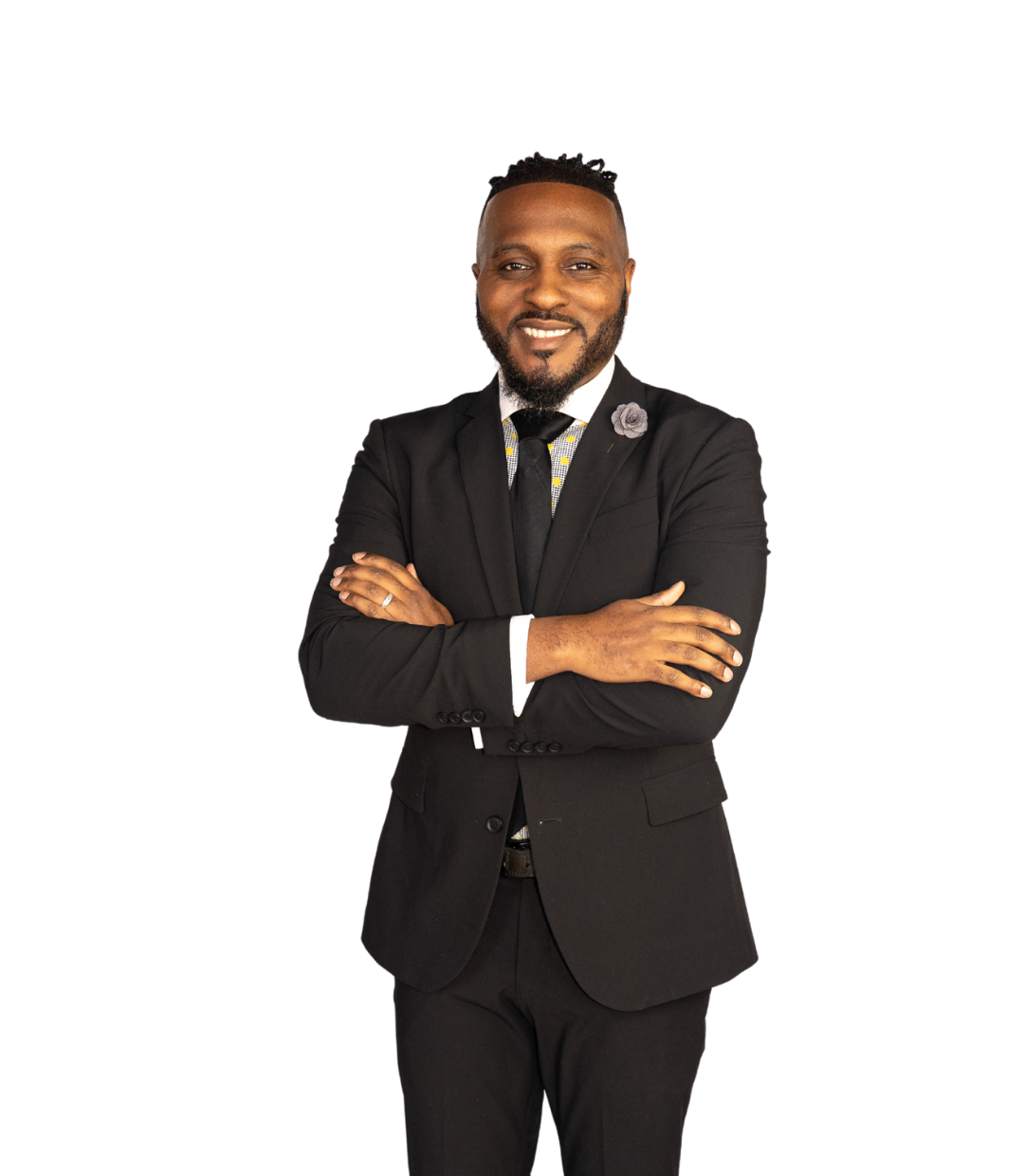 KMJ, founder and consultant, in a black suit with arms crossed, calm and grounded.
